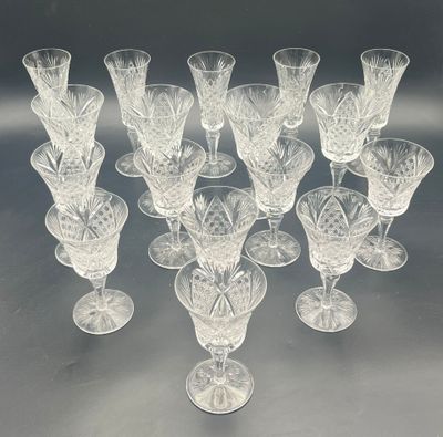 a lot of wine glasses that are sitting on a table