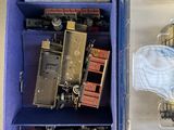 a box with a bunch of toy trains inside of it