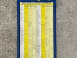 blue and yellow sign on the side of a building with a map on it