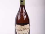 bottle of wine with a label on it sitting on a white surface