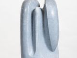 a blue sculpture on a white pedestal with a white background