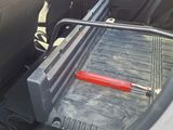 a car that has a tool in the back of it