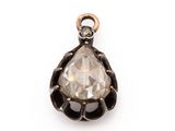a close up of a diamond pendant on a white background