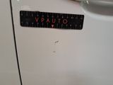 a sticker that says vauto on the side of a white car