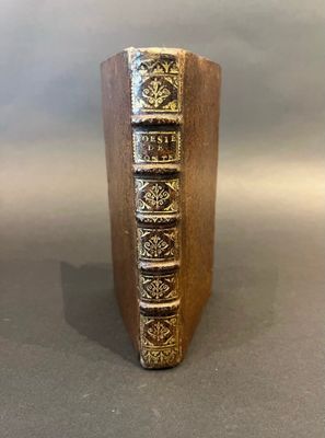 a book that is sitting on top of a wooden stand