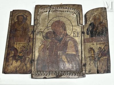 an old wooden panel with a picture of a man holding a child