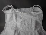 a picture of a white dress on a black background