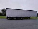 a semi truck that is parked on the side of the road