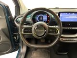 the interior of a car with a steering wheel and dashboard controls