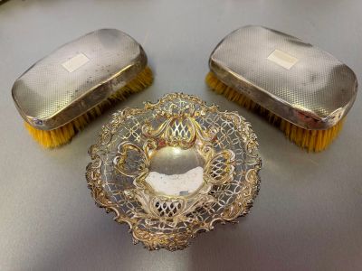 two brushes and a bowl sitting on a table