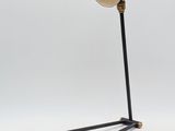 an image of a lamp that is on a stand on a white surface