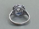 a close up of a diamond ring on a table
