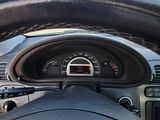 dashboard of a car with a steering wheel and a speedometer