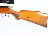 a wooden rifle with a black scope on a white background