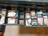 a drawer full of items that are sitting on the floor