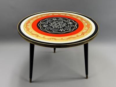 a black and white table with a red and yellow design on it