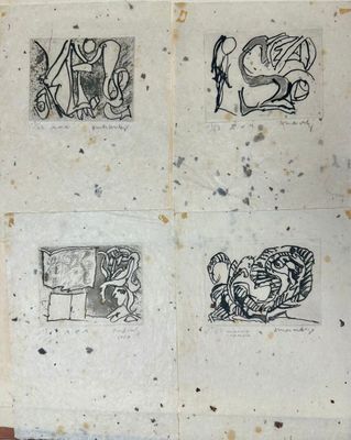 several drawings on a piece of paper on a wooden table