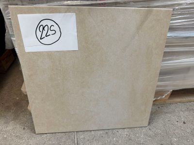 a box of marble tiles on the ground in a warehouse
