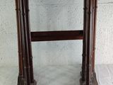 a small wooden table with a shelf on top of it
