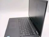 a laptop that is sitting on a white table