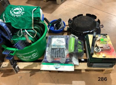 many items that are on a pallet on the floor