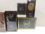 four different types of perfumes are sitting on a table