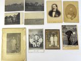 an old photo of a group of men and women posing for a picture
