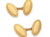 two pairs of gold plated cufflinks on a white background