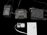 a black bag with a cell phone and other items on it