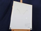 a white board with a drawing on it sitting on a easel