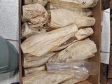 a cardboard box with a bunch of bags in it
