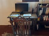 a desk with a chair and a computer on top of it
