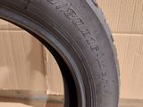 tire tread of a car on a cardboard box in a room