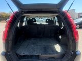 the back end of a car with its trunk open in a parking lot