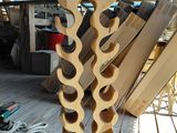 a picture of a wine rack made out of wood