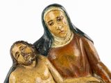 a figurine of a woman and a man sitting on a bench
