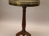 an image of a small table with a gold tray on top of it