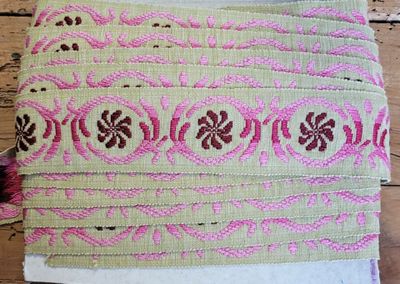 a close up of a piece of fabric on a wooden table