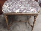 a marble topped table with a drawer in the background