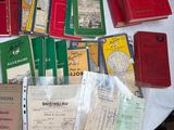 a lot of books on a table with a white table cloth