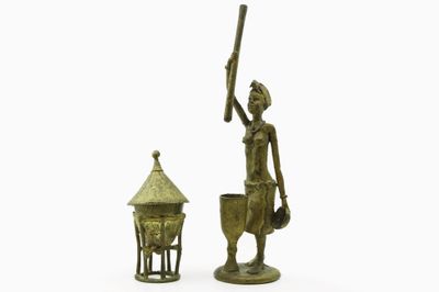 pair of bronze figurines of a woman with a basket and a bird