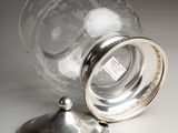 a glass jar with a lid sitting on a table