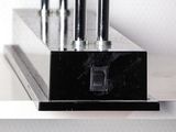 a close up of a metal object on a shelf