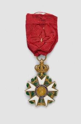 an image of a red ribbon with a gold star on it