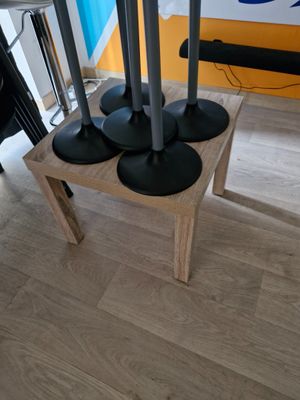 a table with four speakers on it in a room