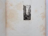 an old book with a picture of a city on it