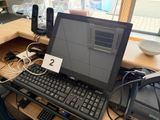 a laptop computer sitting on top of a desk with a keyboard and mouse