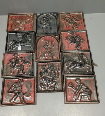 many different types of metal tiles on the table
