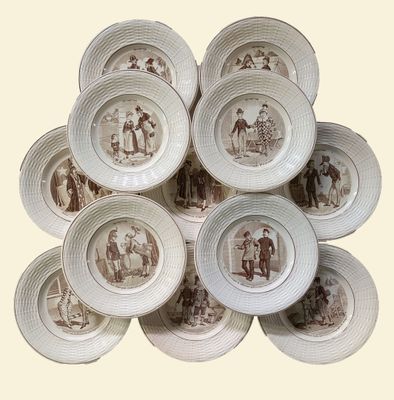 a pile of plates with a picture of people on them