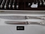 a box with a set of knives and a knife on it
